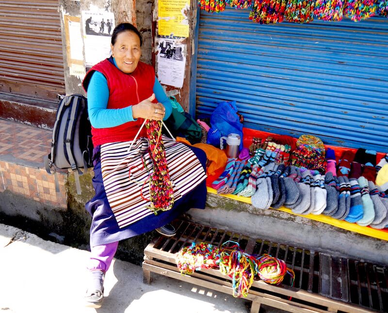 Tibetan lady selling hand made souvenirs in McLeod Ganj, Dharamsala, India